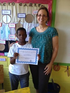 Melvin, proud to receive a well-earned certificate. He completed the first part of the new reading program in record time. He could not read before…..He can now!!
